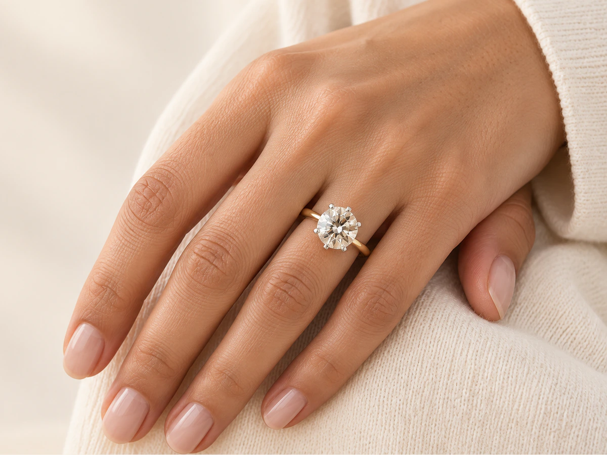Laboratory-grown diamond solitaire ring in yellow gold, worn on the hand - Maanorah Jewellery India